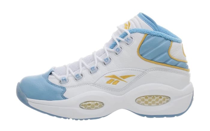 White and blue Reebok shoe.